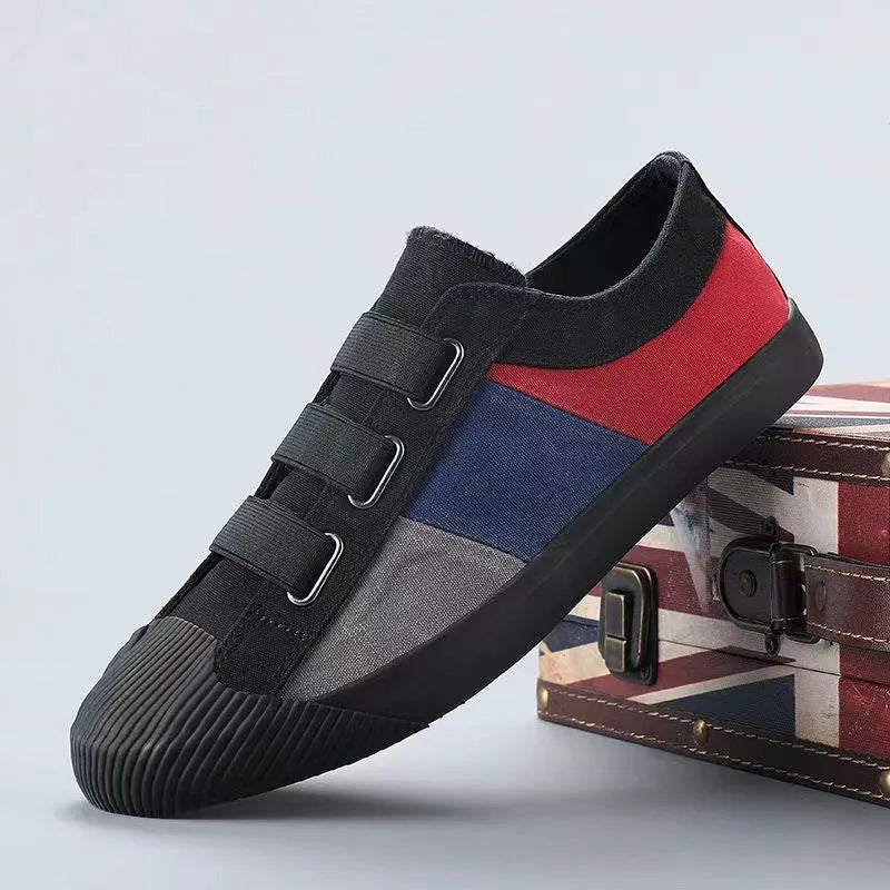 Men's canvas sneakers with rubber sole in multiple colour options showing low top design and elastic band