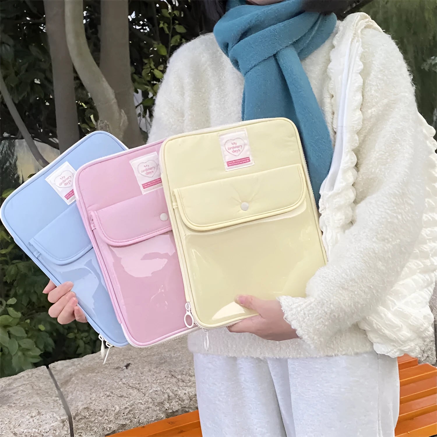 Nylon snap closure tablet bag in five colour options showing black, blue, lotus root, white and yellow variations