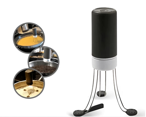 White and black automatic kitchen food stirrer with stainless steel whisk on countertop.