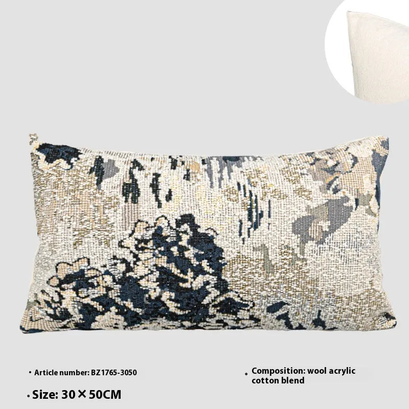 Blue floral antique pattern wool blend cushion cover and feather velvet pillow on a sofa.