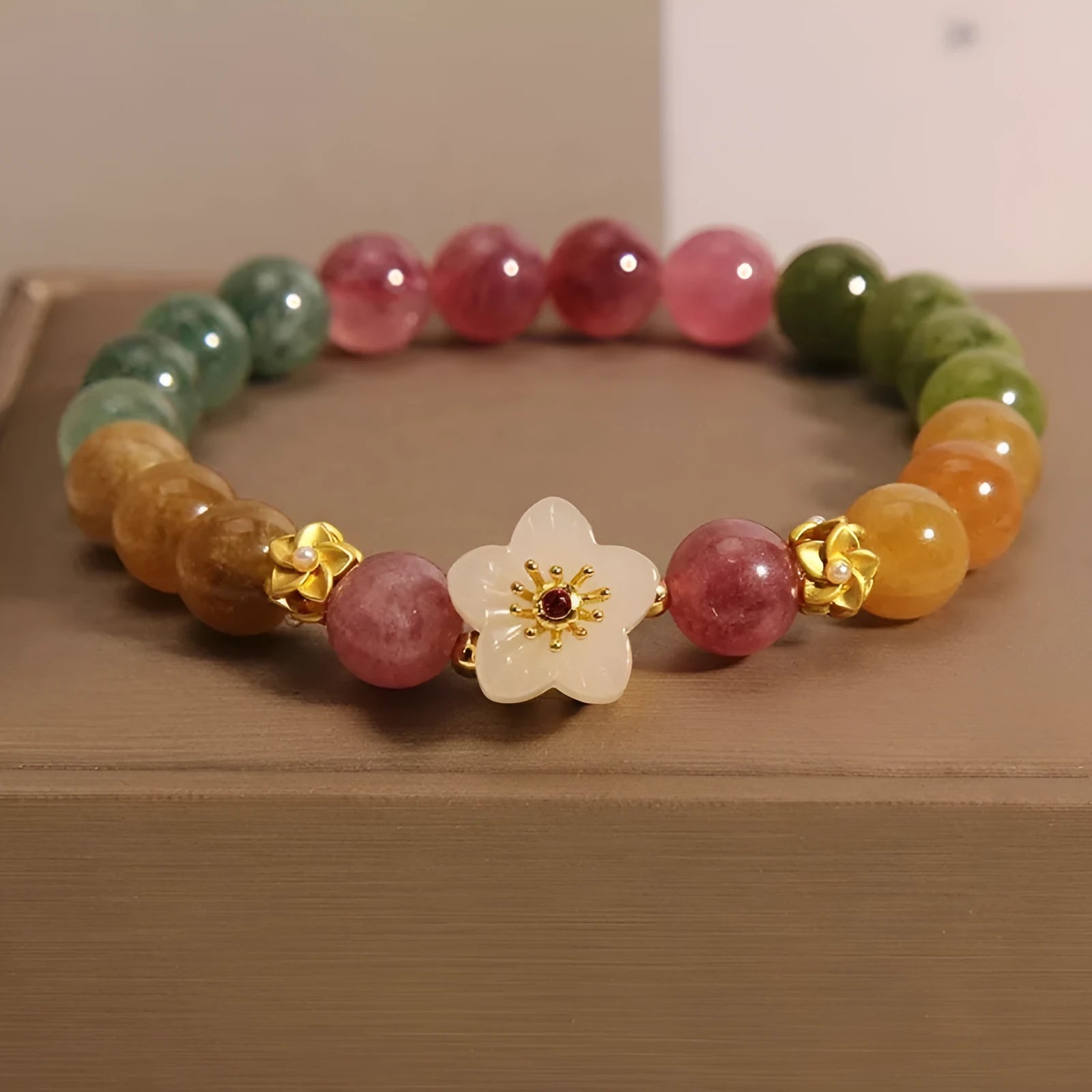 Natural colour tourmaline bracelet with flower design and electroplated finishing