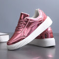 Rose gold platform sneakers with sequin details and a thick MD sole.