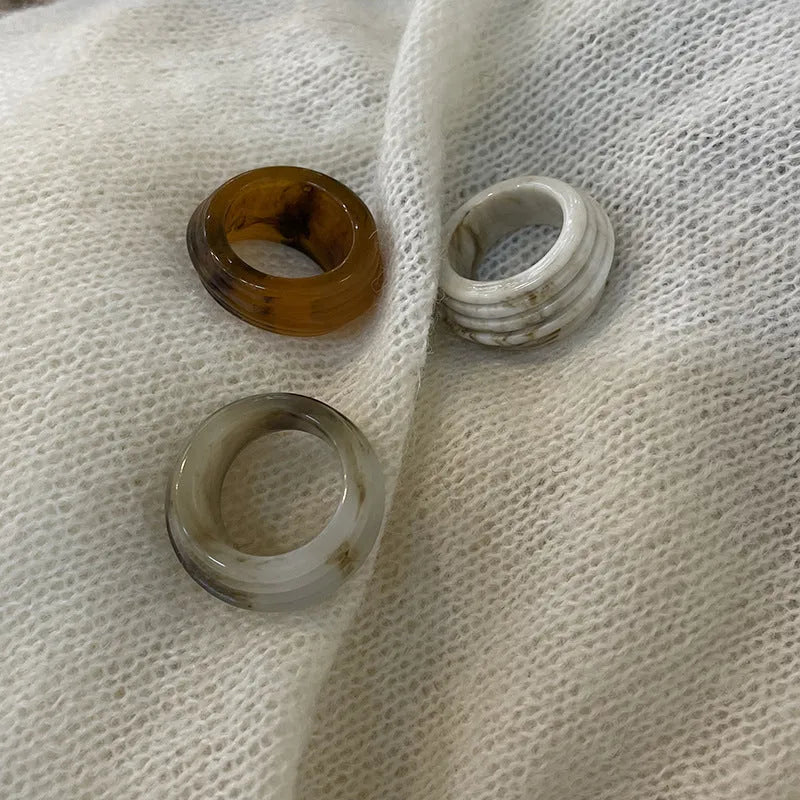 Chinese style geometric resin ring in irregular wide band shape showing three colour options