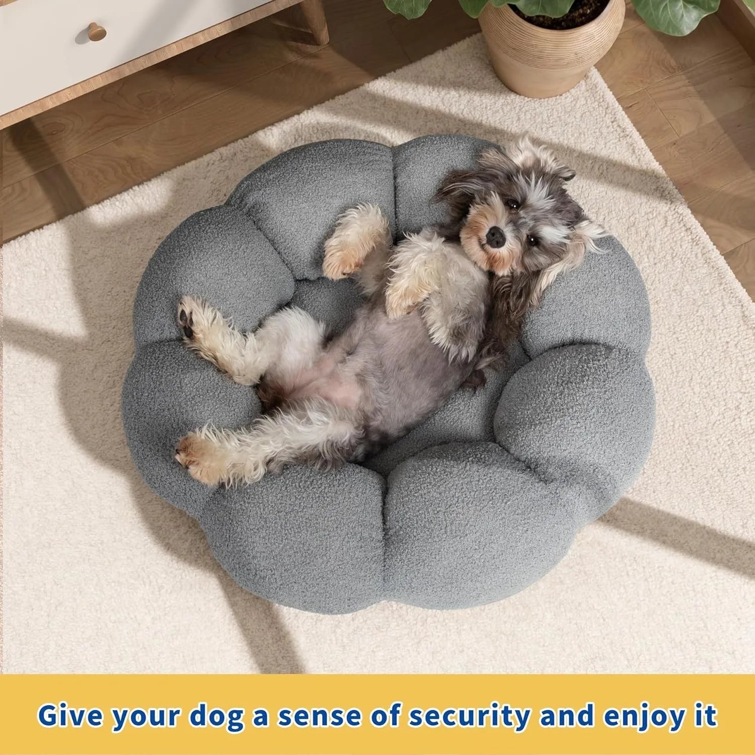 White fluffy flower-shaped pet bed with raised teddy fleece edges and round donut design on a light floor