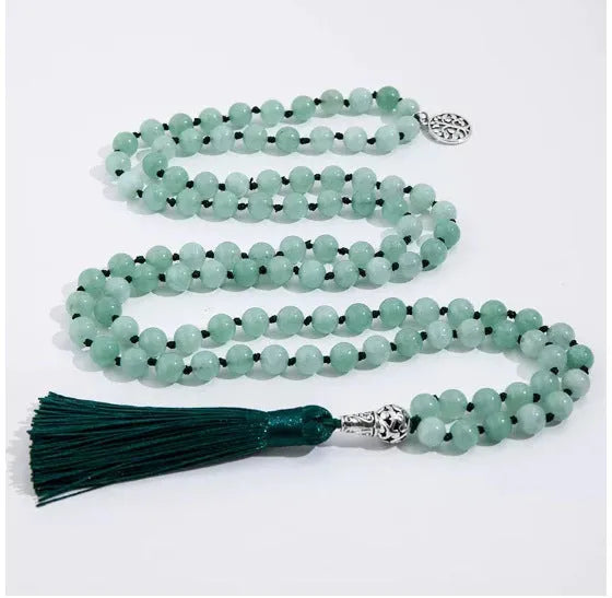 Handmade knotted stone bead necklace with 108 beads, showing geometric design and natural stone colours.
