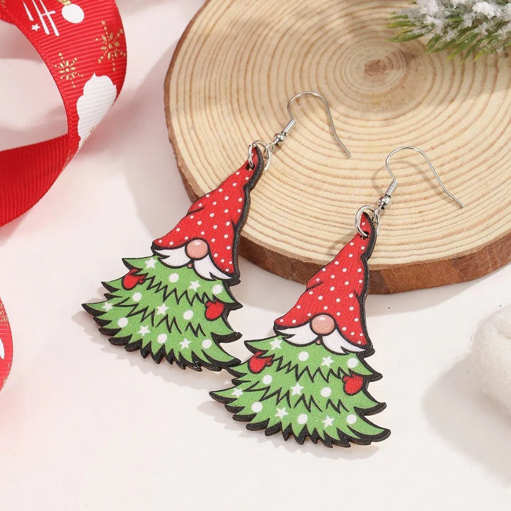 Women's wooden Christmas earrings with printed tree and snowman designs in geometric shapes