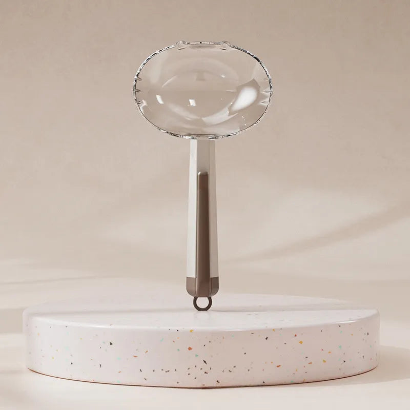 Blue pet food spoon with metal clip attached to a dog food tin.