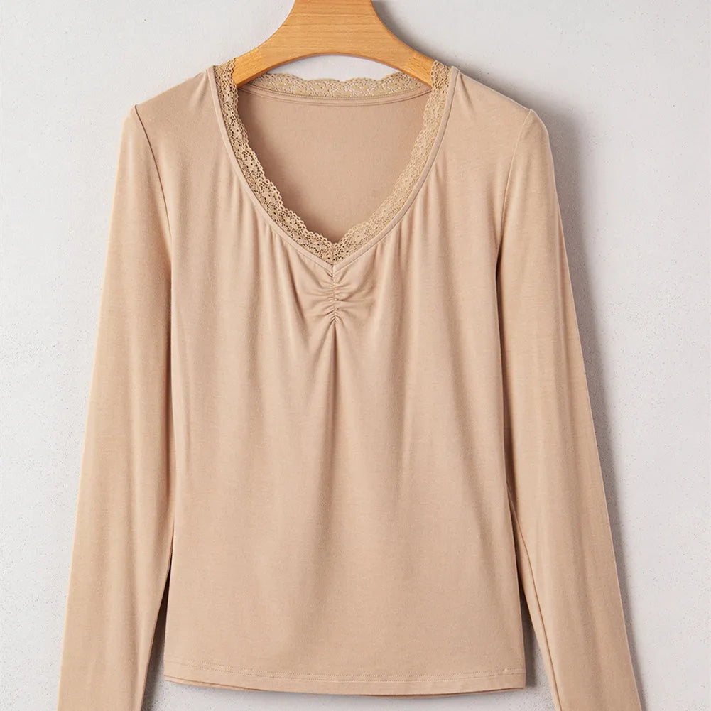 Women's solid colour long sleeve casual top with lace trim, shown in red and skin tone.