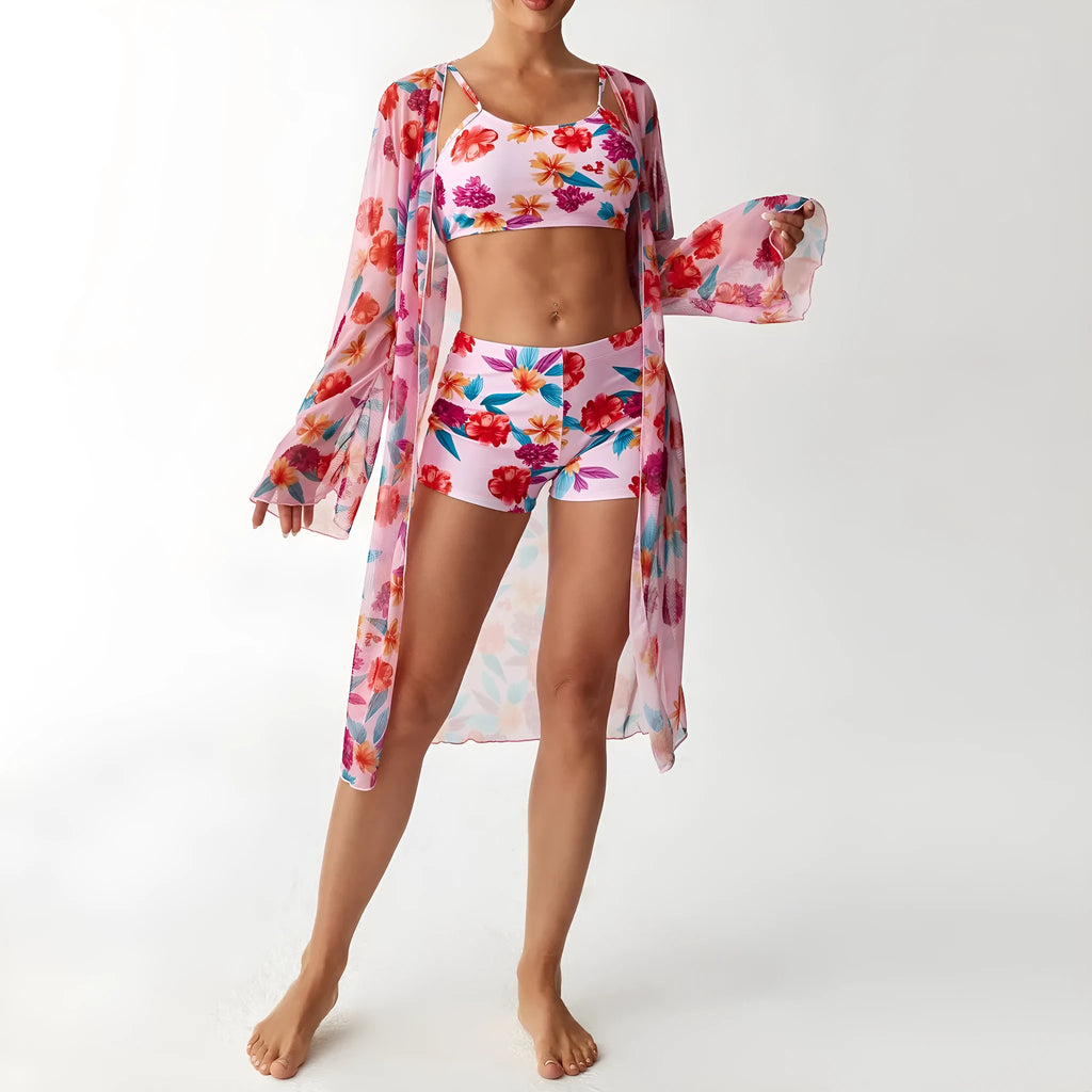 Women's three-piece swimsuit set with long sleeve blouse in pink, black, white, and sapphire blue