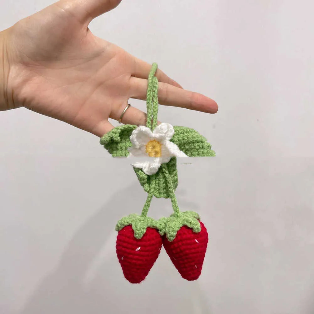 Handmade strawberry-shaped weaving pendant made of cotton and hemp wool for car decoration.
