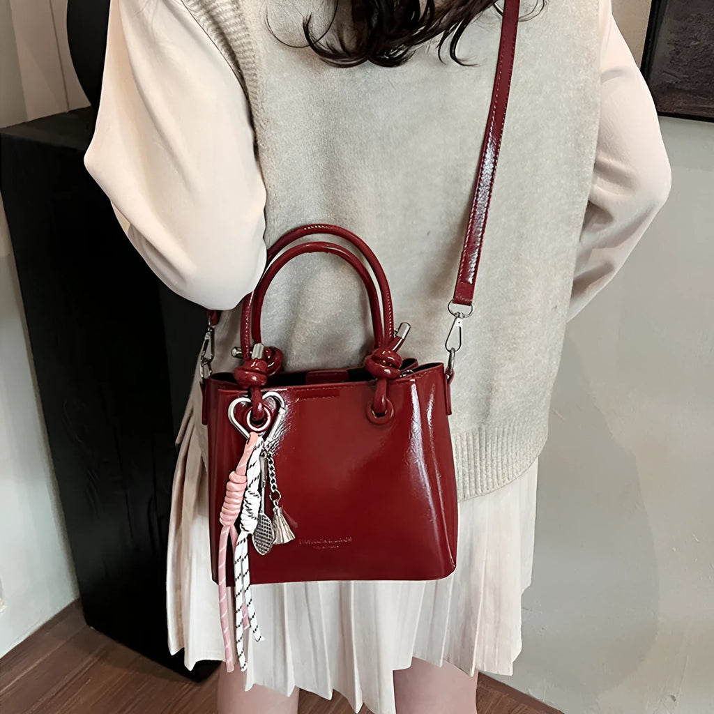 Women's medium-soft PU messenger bag in bucket shape with pendant, black, white, wine red, and pink options