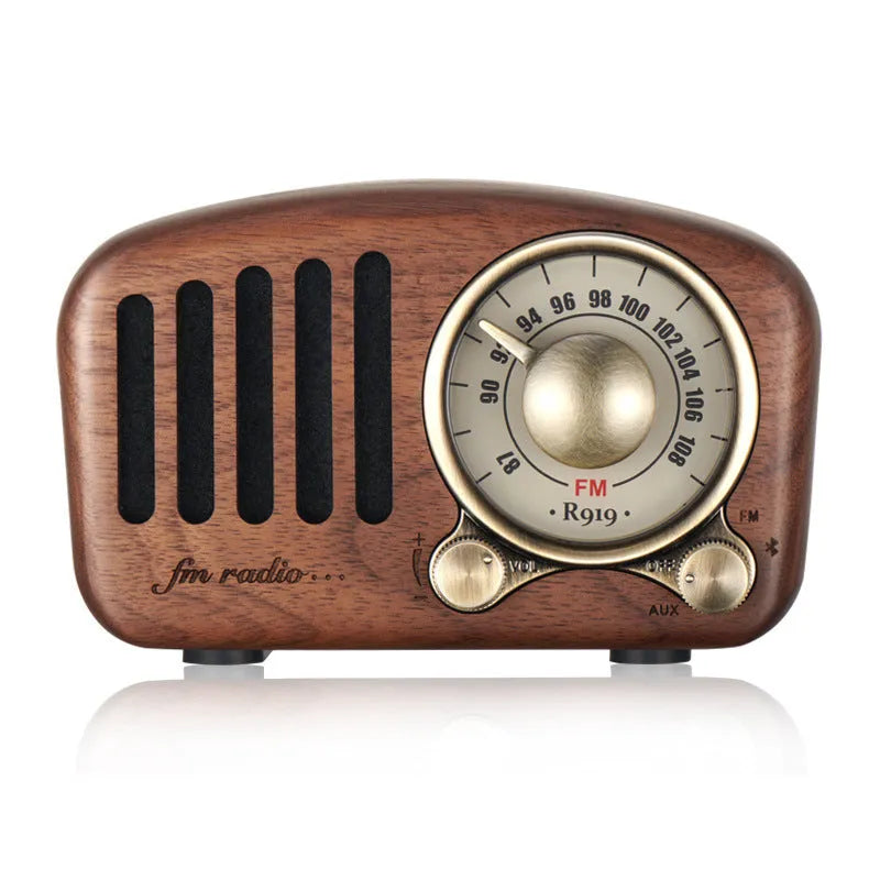 Retro wooden mini Bluetooth speaker in walnut finish showing front grille and side USB port
