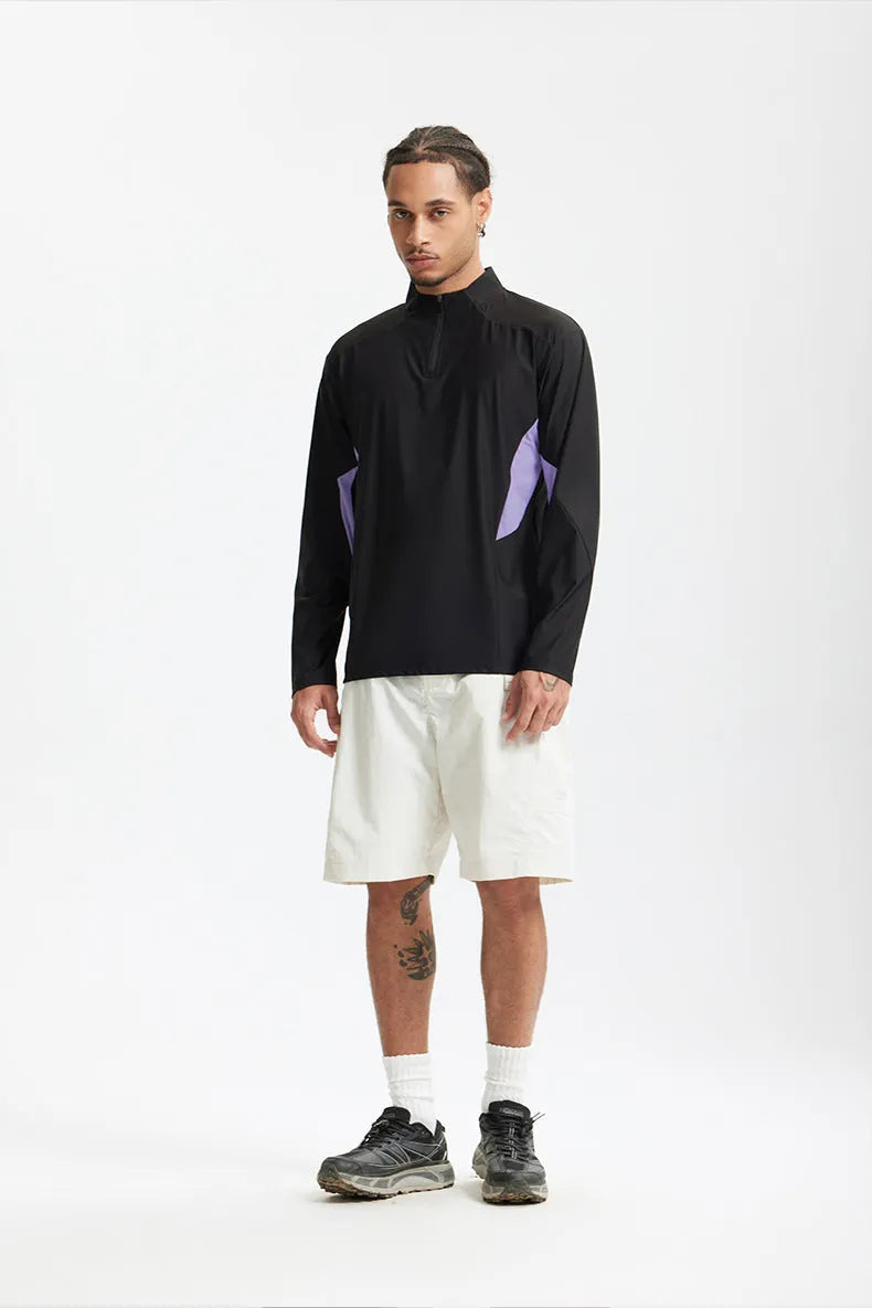 Man wearing a solid beige lightweight long sleeve polyester casual top