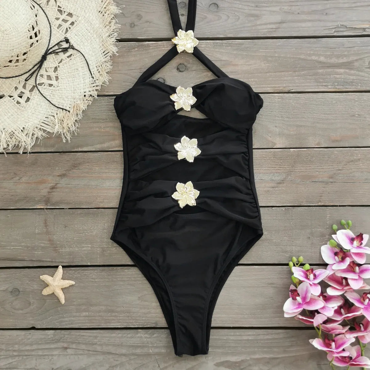 Women's solid colour one-piece swimsuit with hollow-out tube top and matching short skirt on hanger.