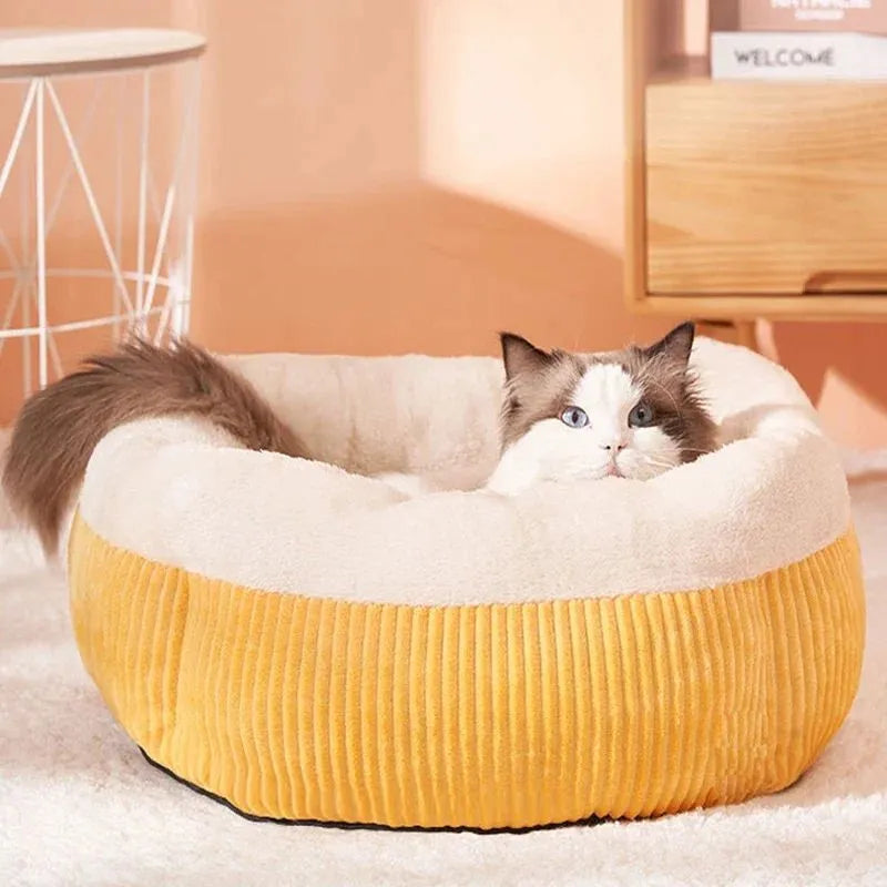 Washable circular cat sofa bed in yellow with plush fabric and non-slip base for calming sleep