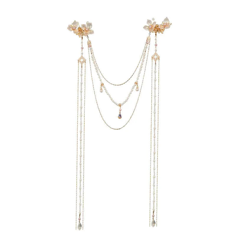 Gold-coloured acrylic hairpin with a long tassel and diamond-treated flower decoration.