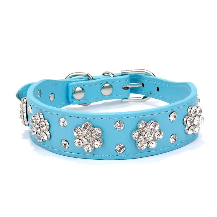 Black PU leather dog collar with rhinestone flower pattern and studs, adjustable for small dogs.