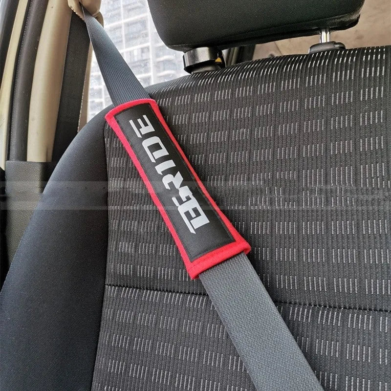 Car seat belt shoulder pads in black, blue and red options with cotton sponge cloth construction