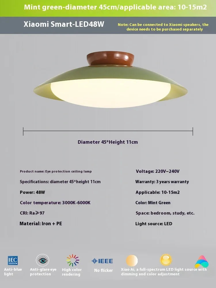 Modern cream style flying saucer shaped ceiling lamp in an iron shade.