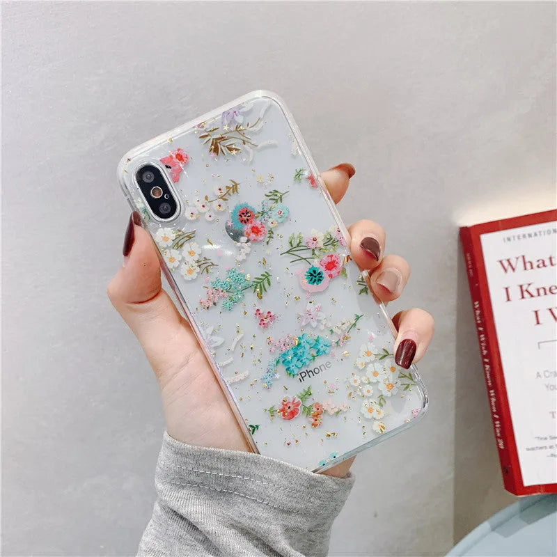 Gold foil epoxy flower pattern iPhone back cover case for iPhone 11 Pro on a table