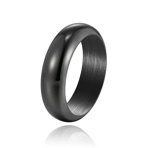 Glossy electroplated titanium steel ring in gold, black and steel colours showing metallic finish