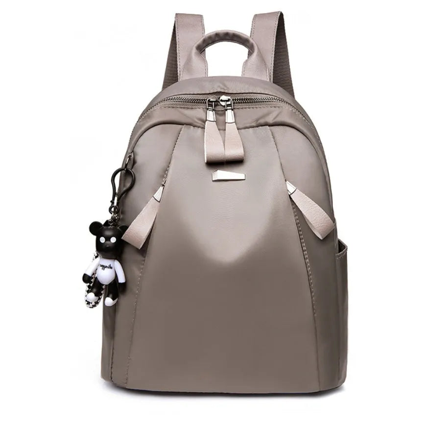 Medium square rucksack in wine red with front digging bag and dual straps.