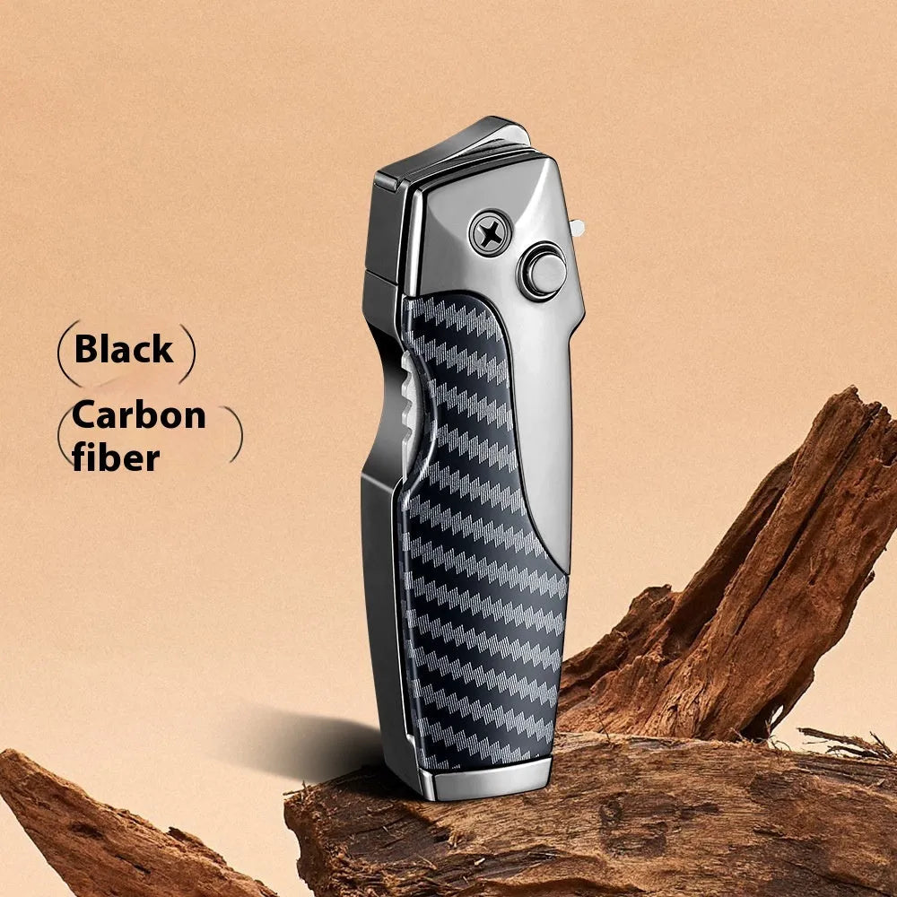 Closed metal folding lighter with integrated knife in a carbon fibre finish, showing the safety lock and refill valve.