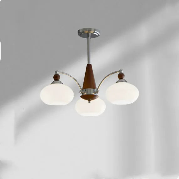 Persimmon glass and chrome chandelier with multiple glass lampshades in a choice of colours.