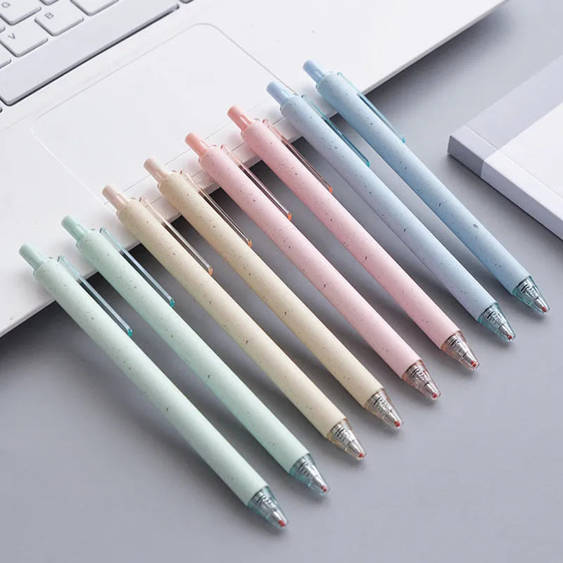 Set of 12 push-type 0.5mm gel pens in beige, blue, green, and pink colours on a white background
