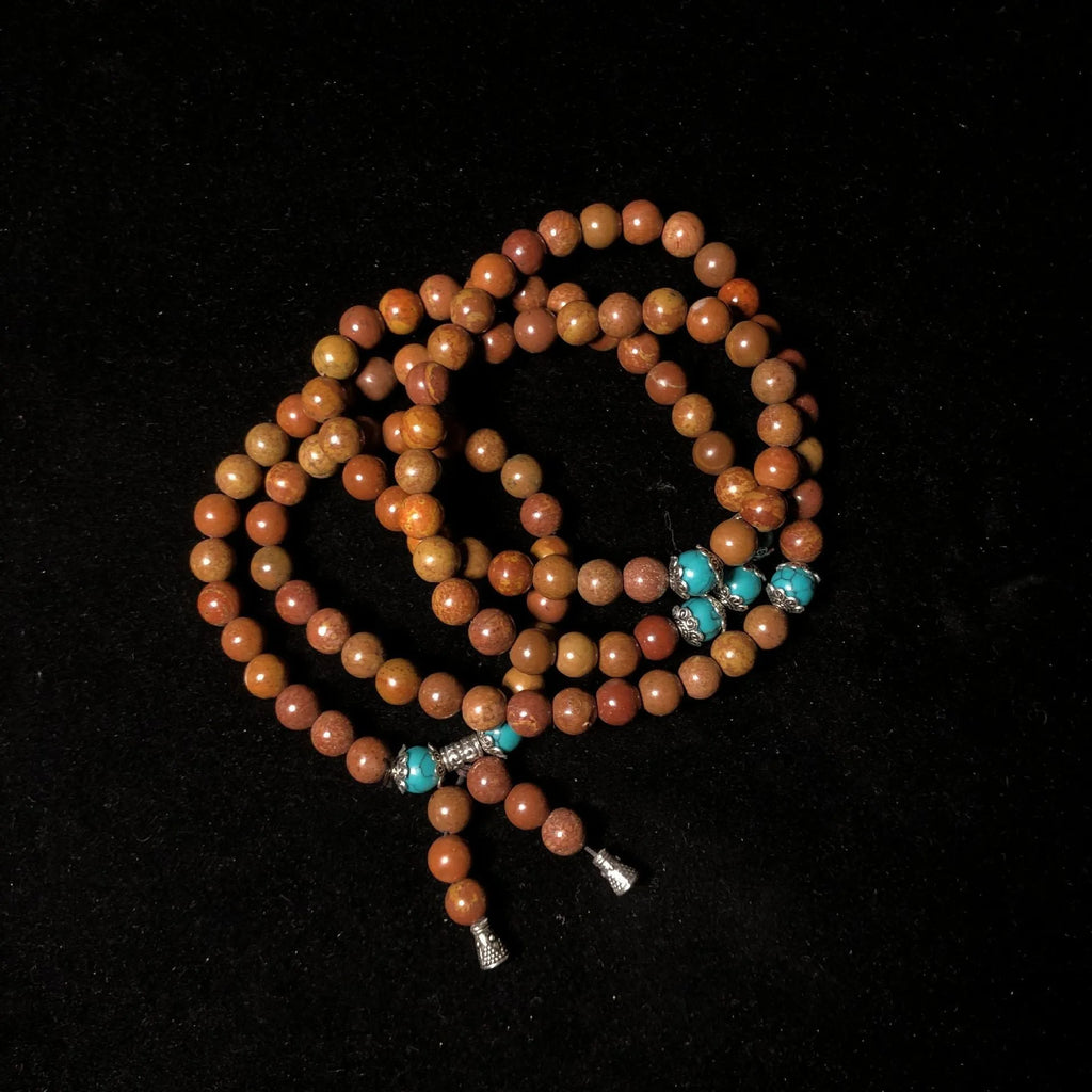 108-bead stone bracelet with geometric hand-polished beads measuring 5-6mm diameter