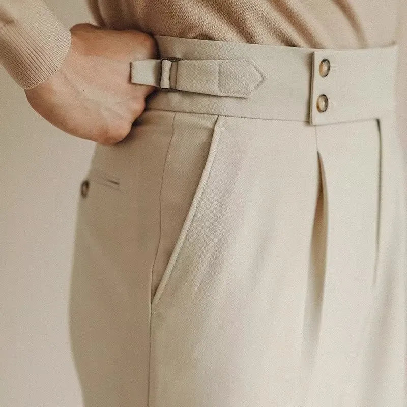 Men's slim fit straight leg suit trousers in black, white, or apricot colour on a hanger.