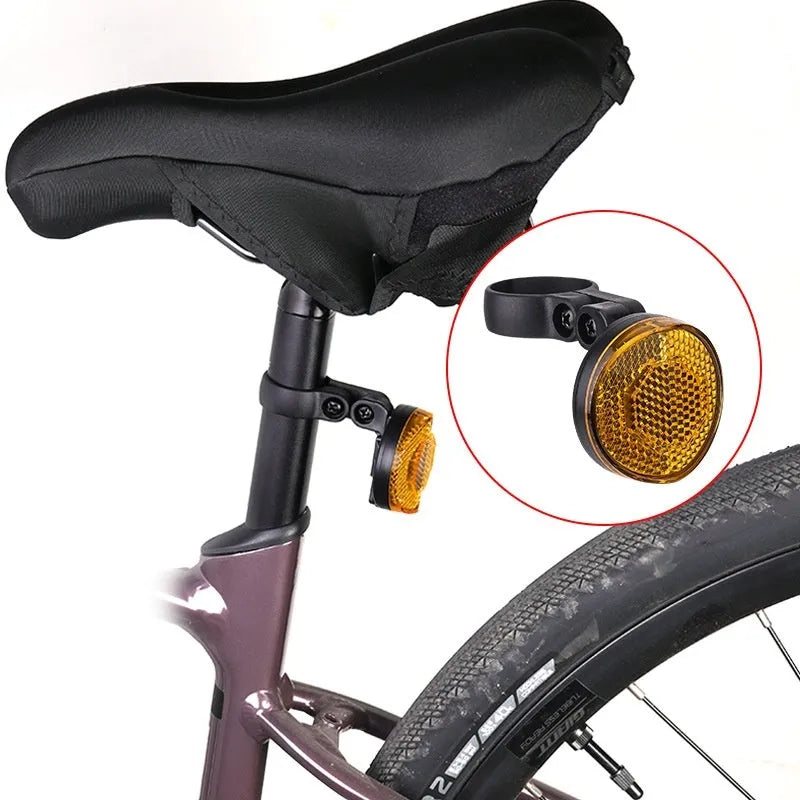 Red plastic bicycle seat post bracket for mounting a rear anti-theft taillight.