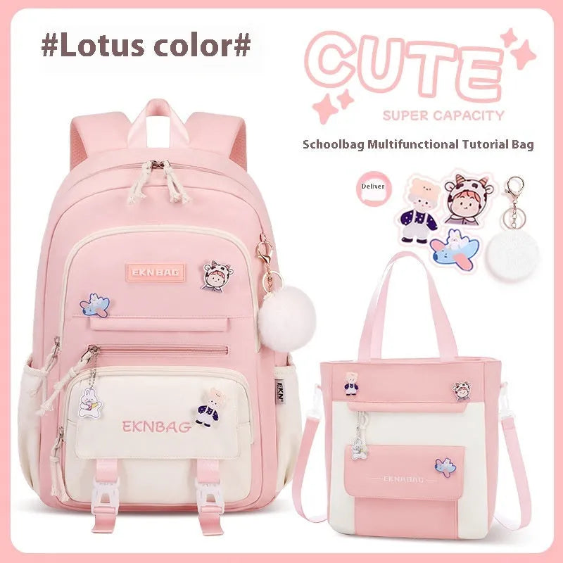 Pink waterproof Oxford cloth school backpack for girls with curved shoulder straps.