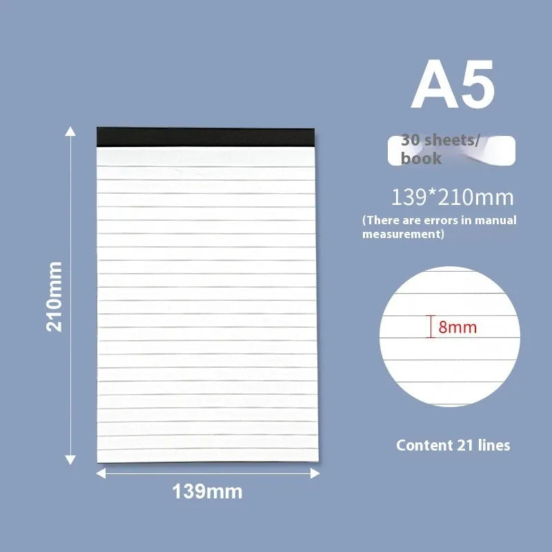 A4 wire-o bound tear-off notepad open on a table, showing ivory white grid pages.