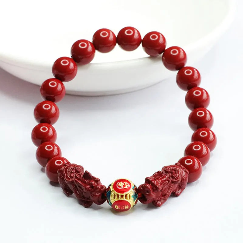 Close-up of a purple gold sand carved cinnabar women's bracelet with a double Pixiu design.
