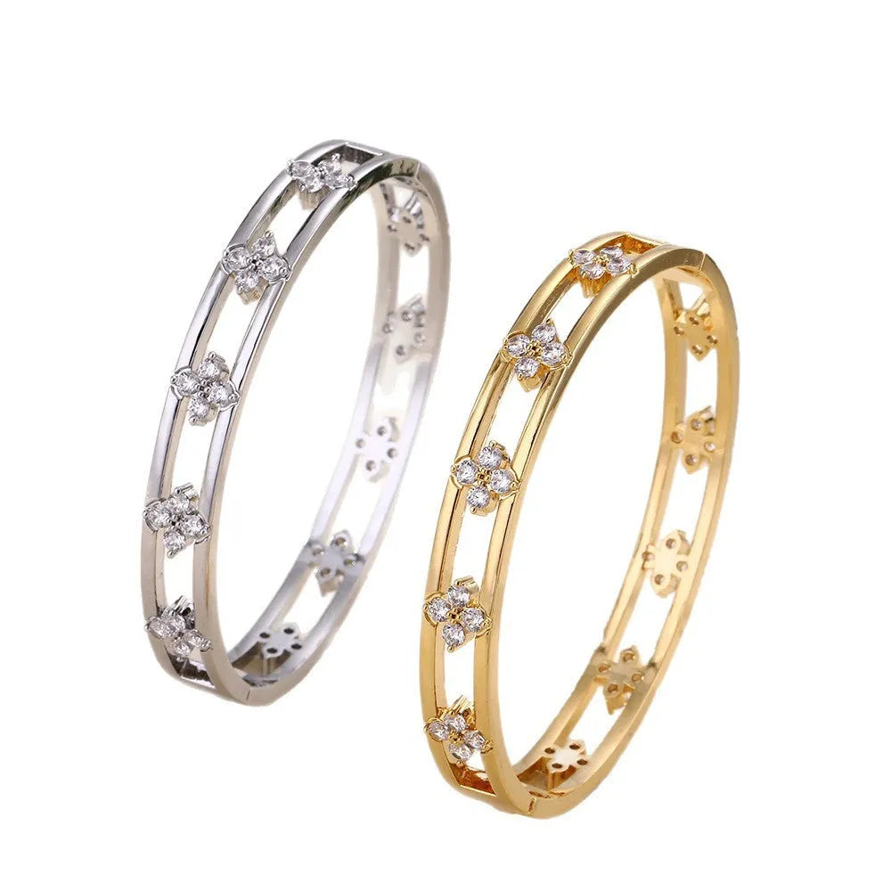Women's hollow bracelet with zircon stones and four-leaf clover design in gold or silver colour