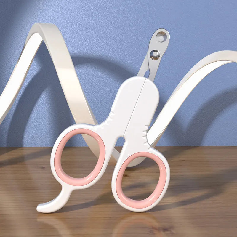 Grey and pink pet nail clippers with curved tips and a rubber-coated anti-slip handle on a white background.