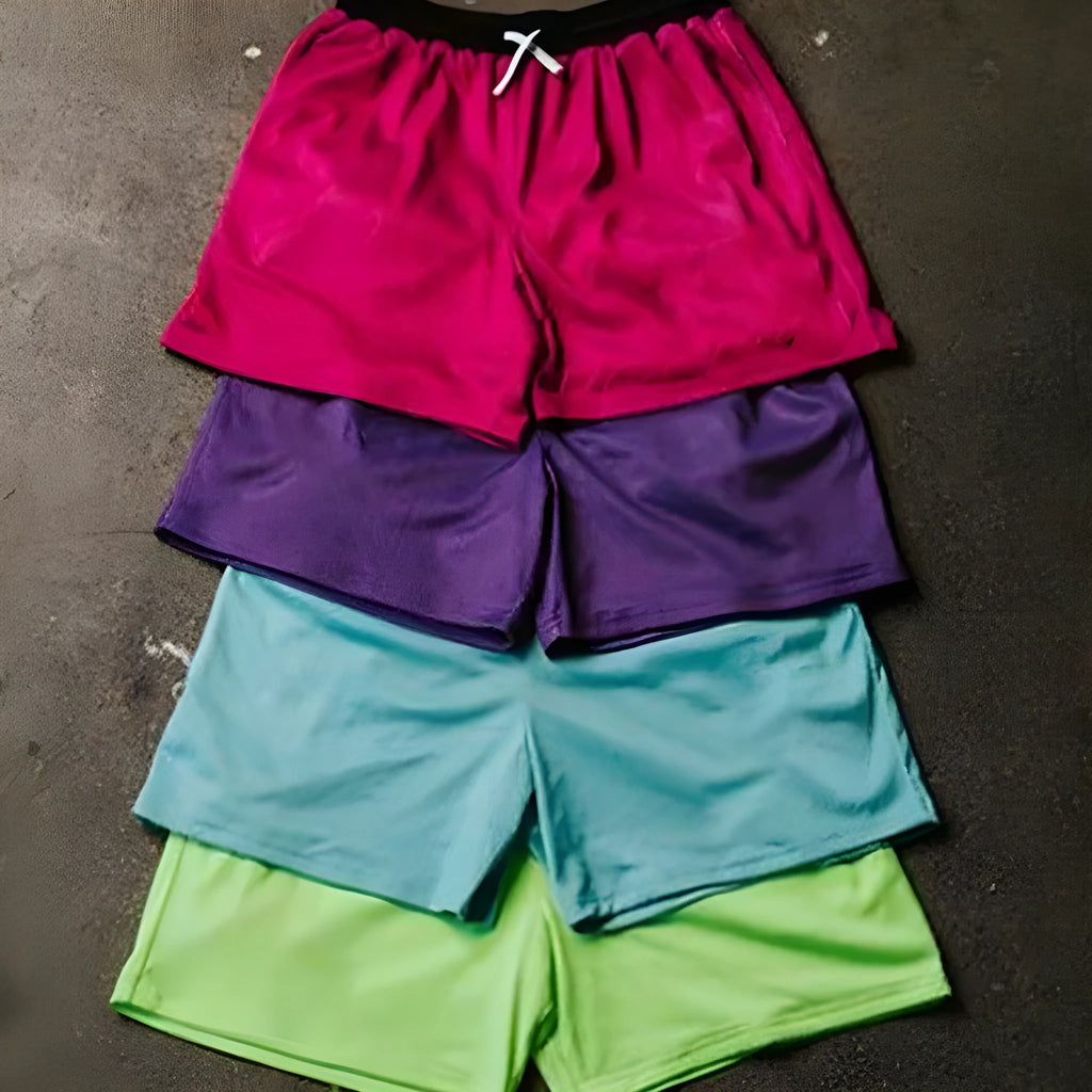 Men's solid colour quick-drying mesh sports shorts in black, shown for running.