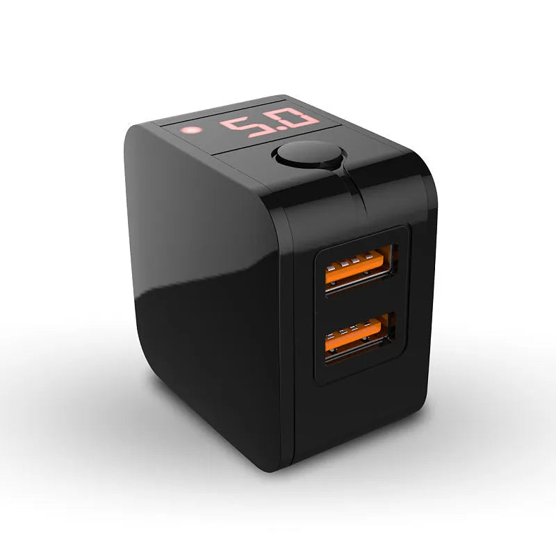 Black 5V2.4A dual USB fast charger with digital voltage display plugged into UK wall socket