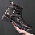Black mid-calf cowboy boots with a side zipper, round toe, and a horseshoe heel on a plain background.