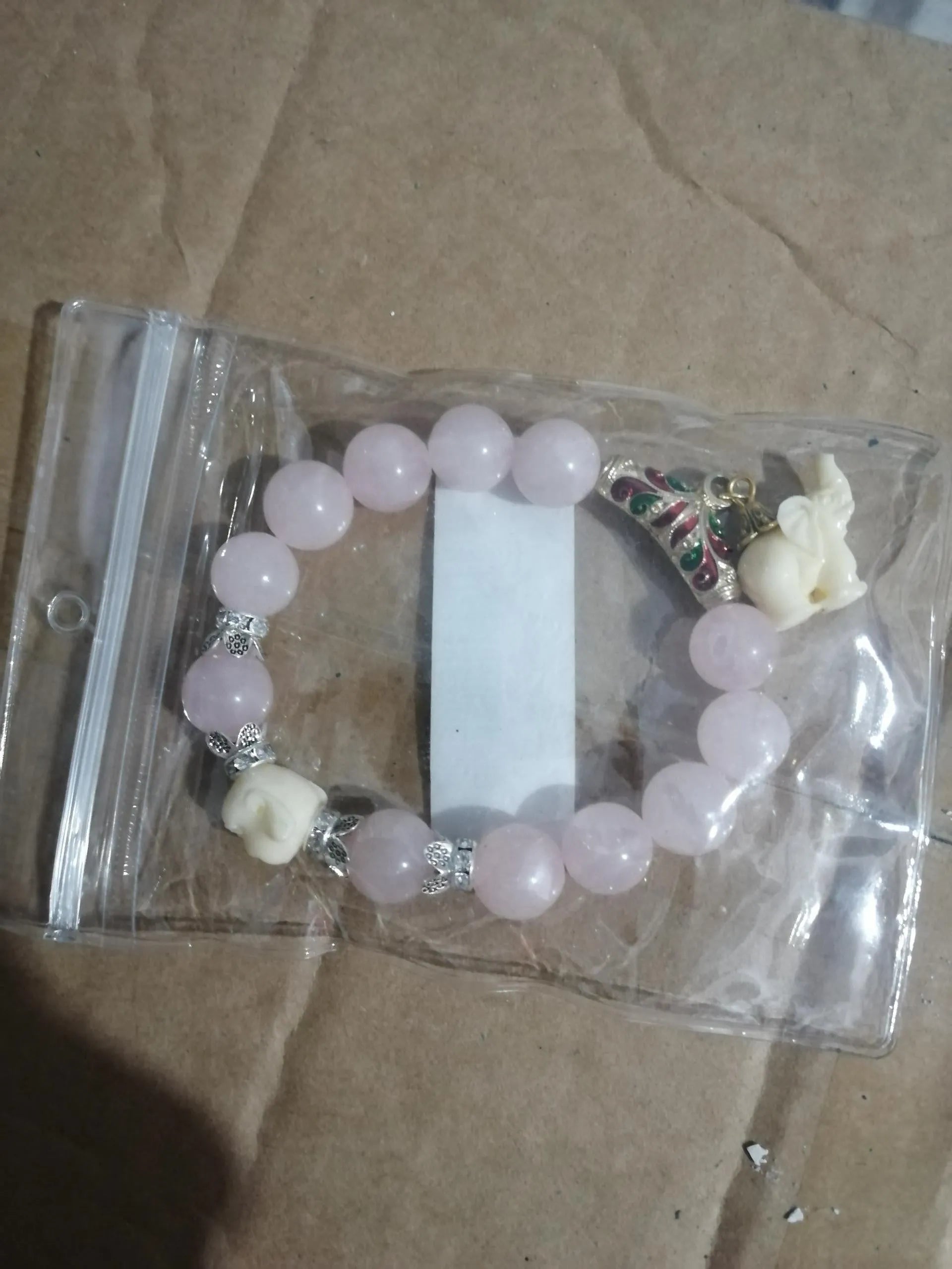 Crystal elephant charm bracelet with clear beads and gold finish metal charm
