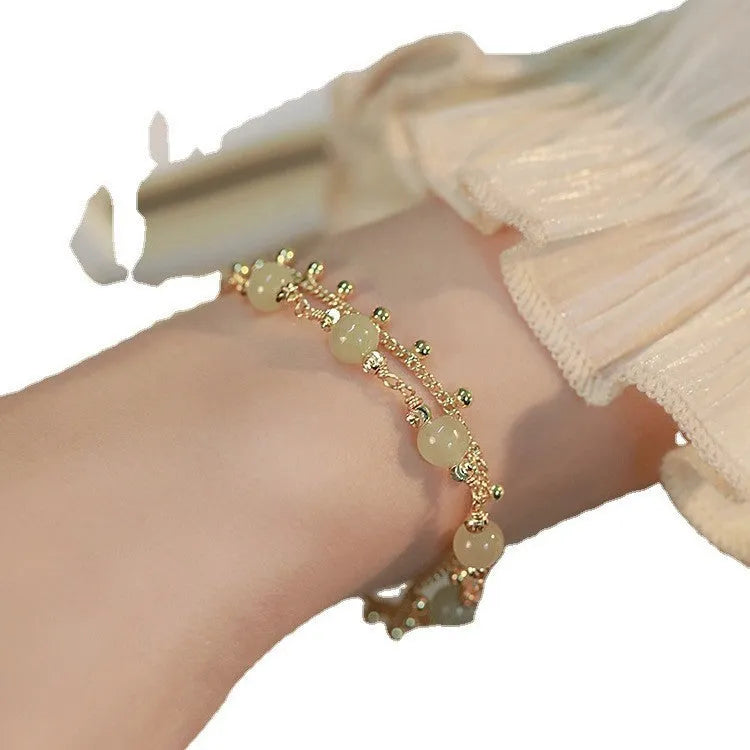 Natural Hetian Jade bracelet with princess running motif for women's daily wear.