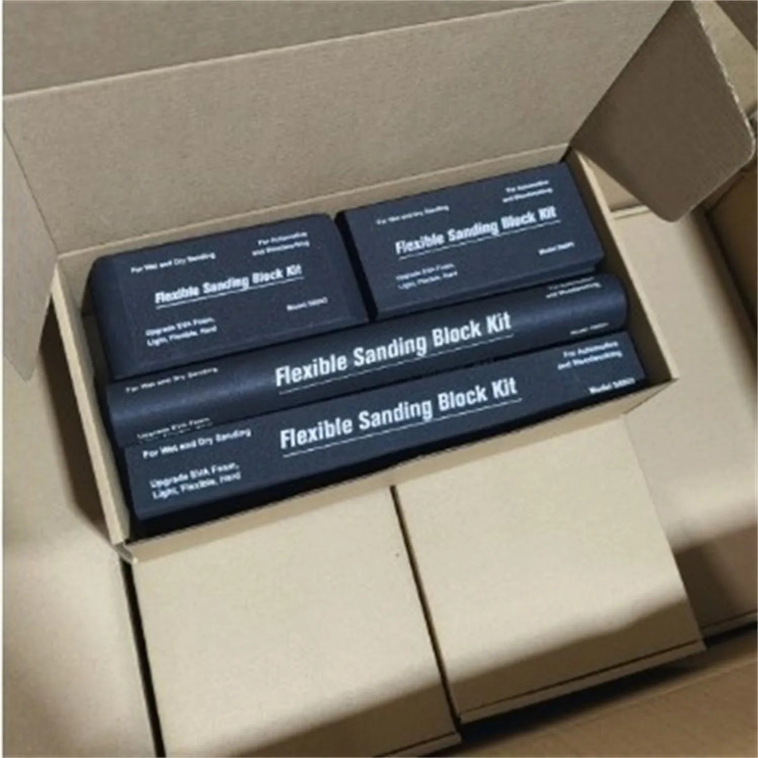 Seven black EVA frosted building blocks with metal connectors for construction and modelling