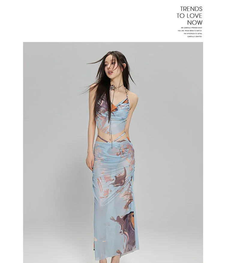 Women's blue printed three-piece bikini set with triangle top featuring steel wire support and a detachable skirt.