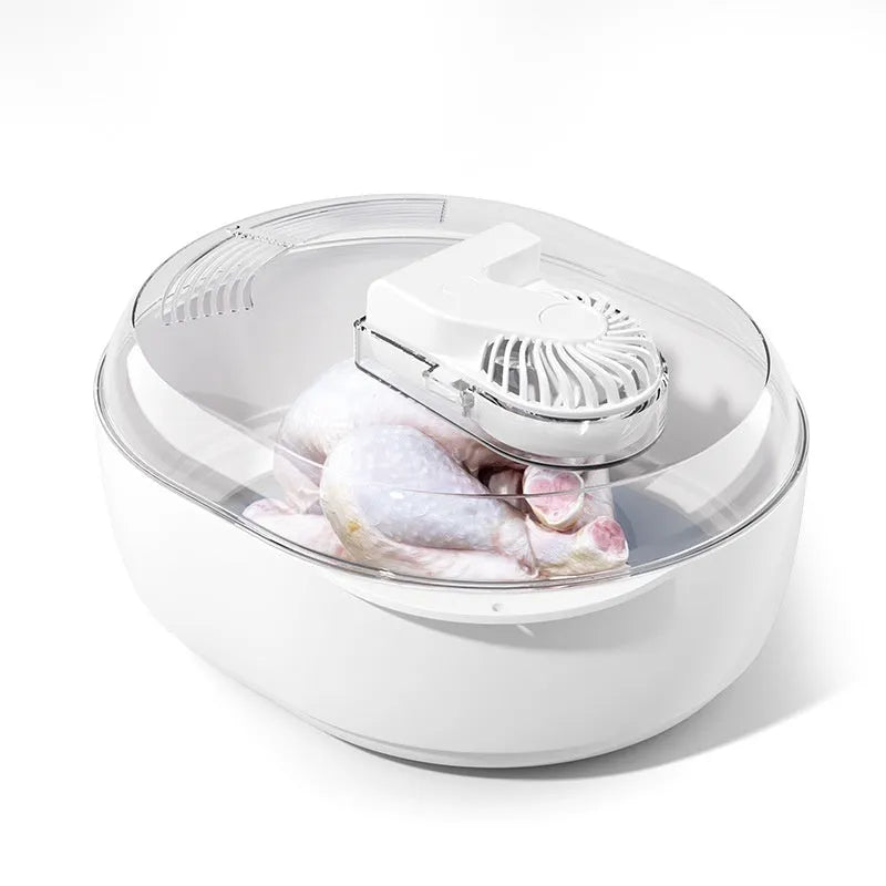 Aluminium household quick defrosting plate device with separate board and USB cable on a kitchen counter.