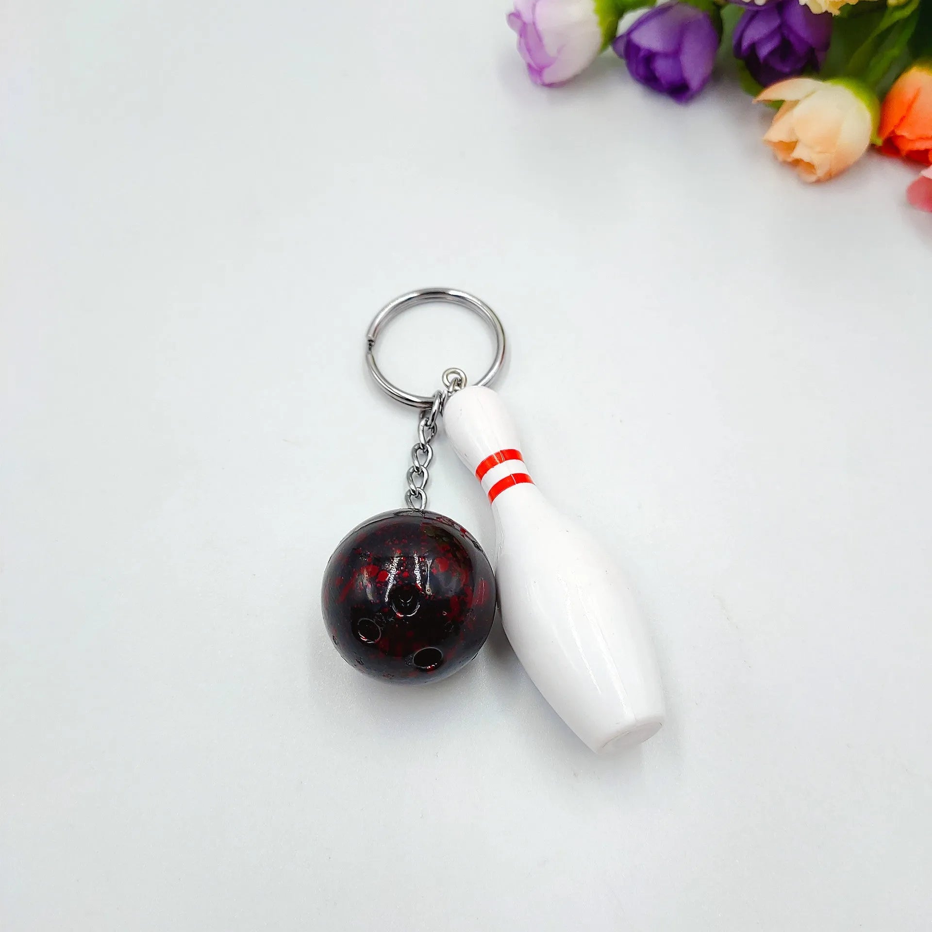 Miniature bowling alley simulation keychain pendant in blue colour with metal key ring