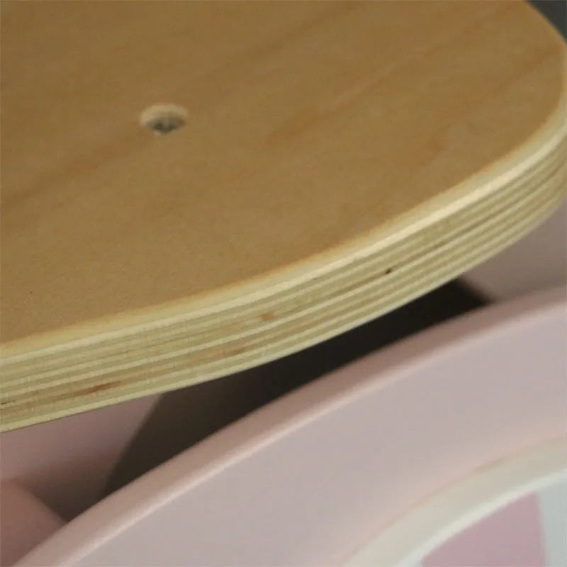 Pink wooden balance scooter for toddlers and children, 10 inches in size.