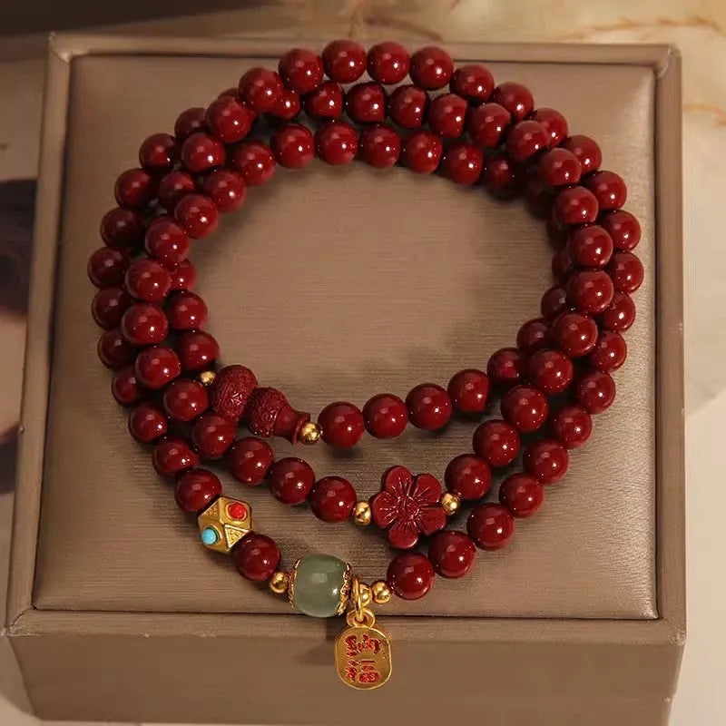 6mm cinnabar bracelet with multi-circle gourd and five petal flower Chinese design in polished finish