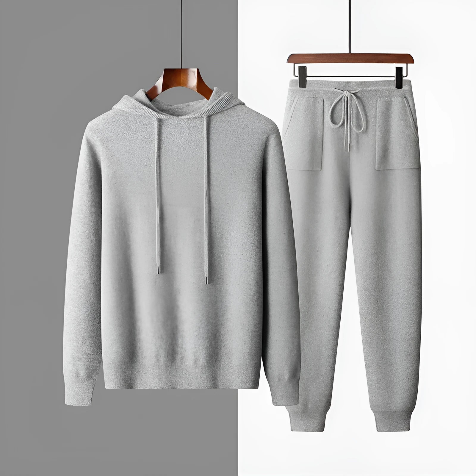 Men's light grey cashmere knitted hoodie and matching long pants casual set laid flat.