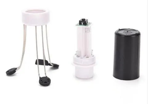 White and black automatic kitchen food stirrer with stainless steel whisk on countertop.